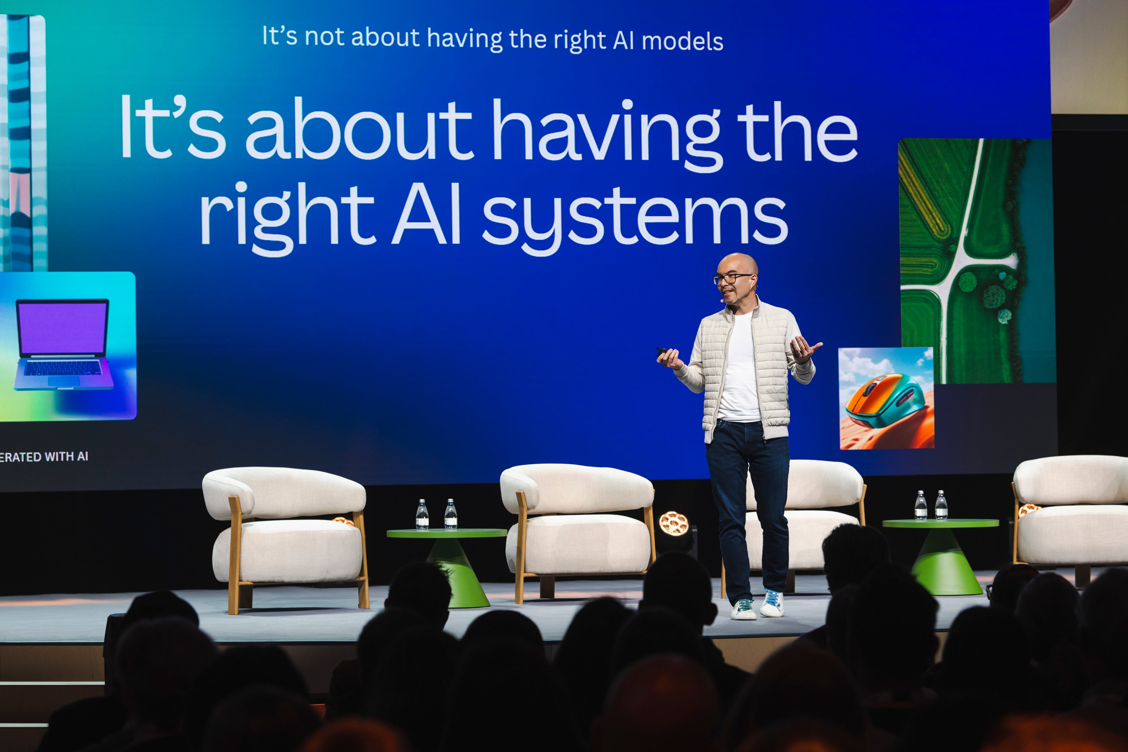 Cameron Adams speaking on stage at Canva AI Vision Sydney in 2026