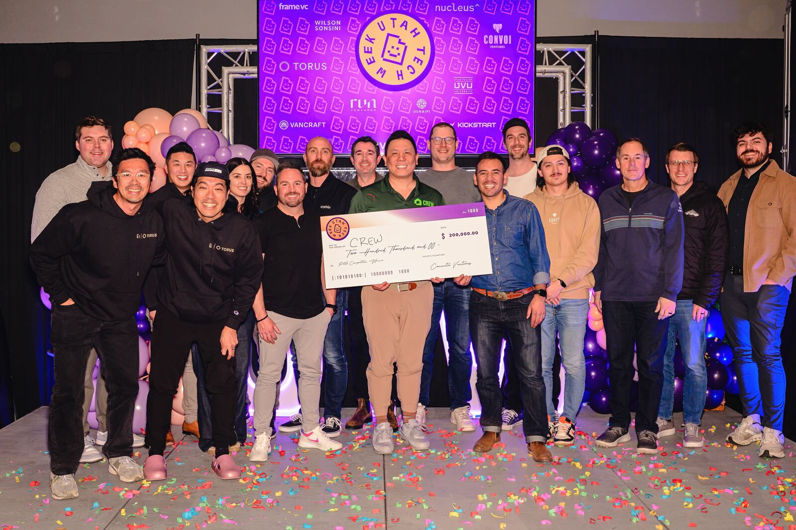 Cameron Lam with attendees on the Utah Tech Week stage after Crew’s pitch competition win