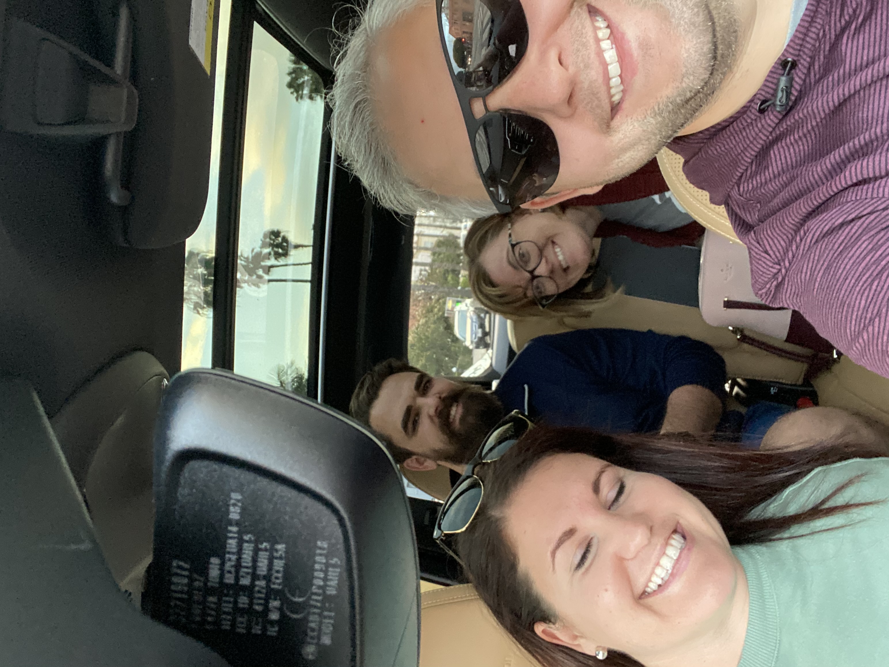 A candid photograph of Cameron Weeks and the BACK Ventures team together in a car