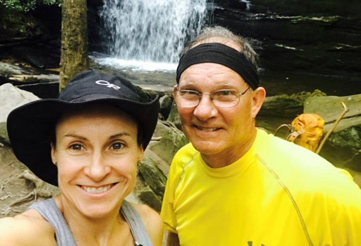 Camille Renshaw and her father Dennis hiking near a waterfall on the Appalachian Trail