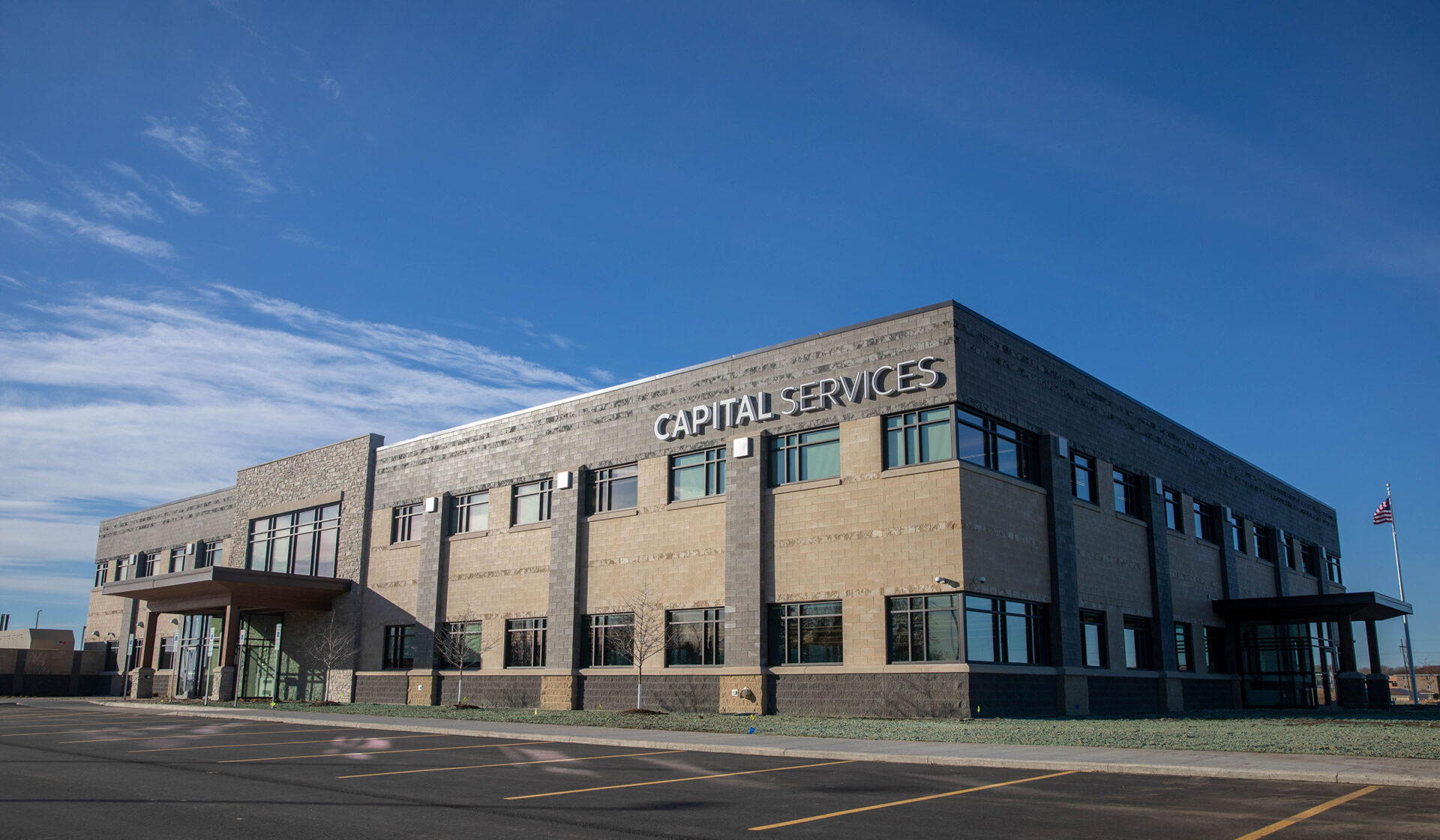 CAPITAL Services’ two-story Sioux Falls headquarters under a blue sky