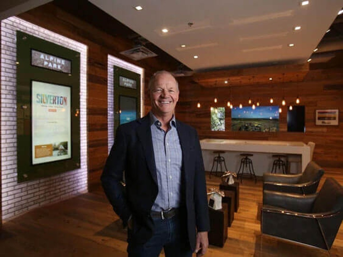 Ryan Ockey, CEO of Cardel Homes, standing inside a Cardel presentation space