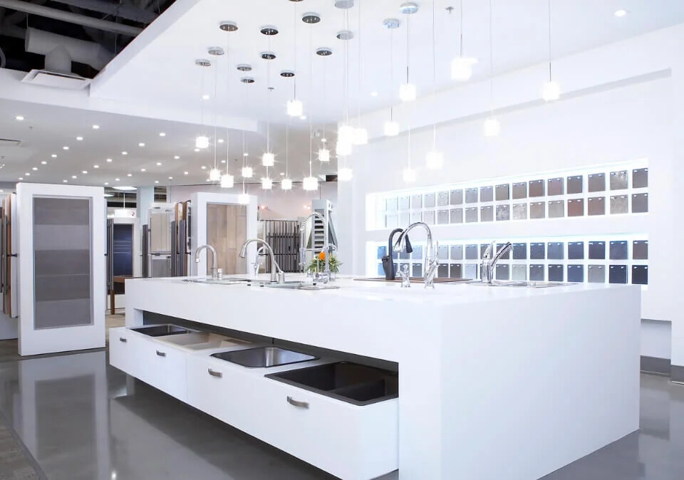 Cardel Homes design centre with illuminated material samples and kitchen fixtures