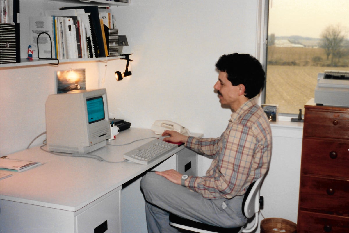 Archival photograph of Chip Cargas working at a Macintosh computer