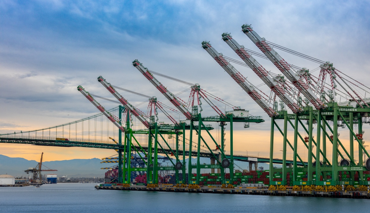 Container cranes beside a suspension bridge in a photograph used in CargoSprint’s SprintPort materials