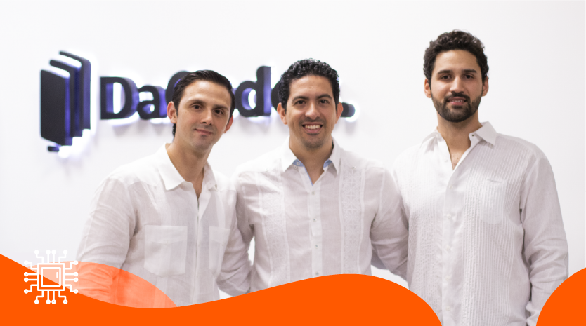 The three DaCodes founders standing together at the company office