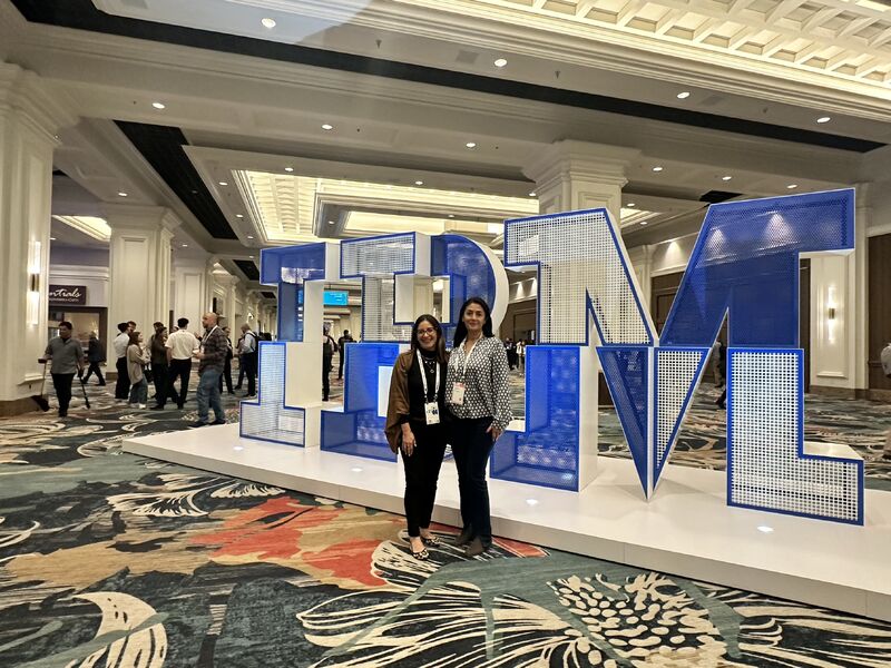 Carolina Mondragón Romero and Amanda Merchán Guerra standing at IBM TechXchange 2024 in Las Vegas