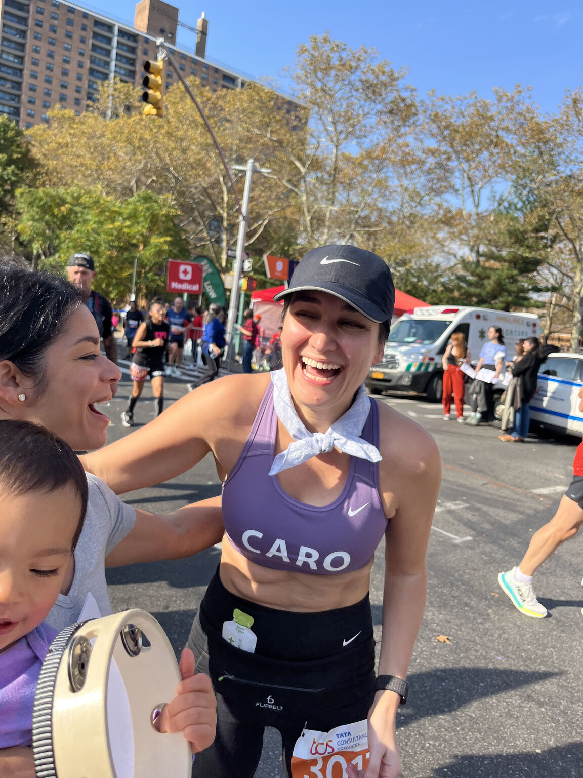 Caroline Solis Wright smiling with supporters during the New York City Marathon