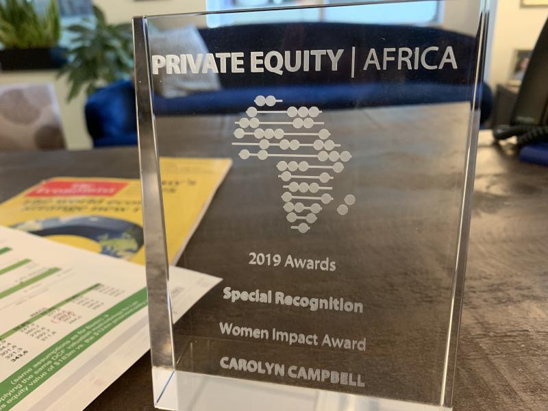 Carolyn Campbell’s 2019 Private Equity Africa Women Impact Award, photographed on a desk