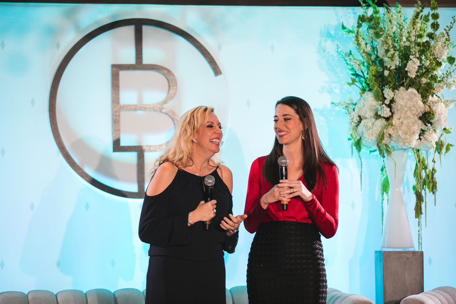 Elizabeth Gore, left, and Carolyn Rodz holding microphones at Circular Summit in Houston