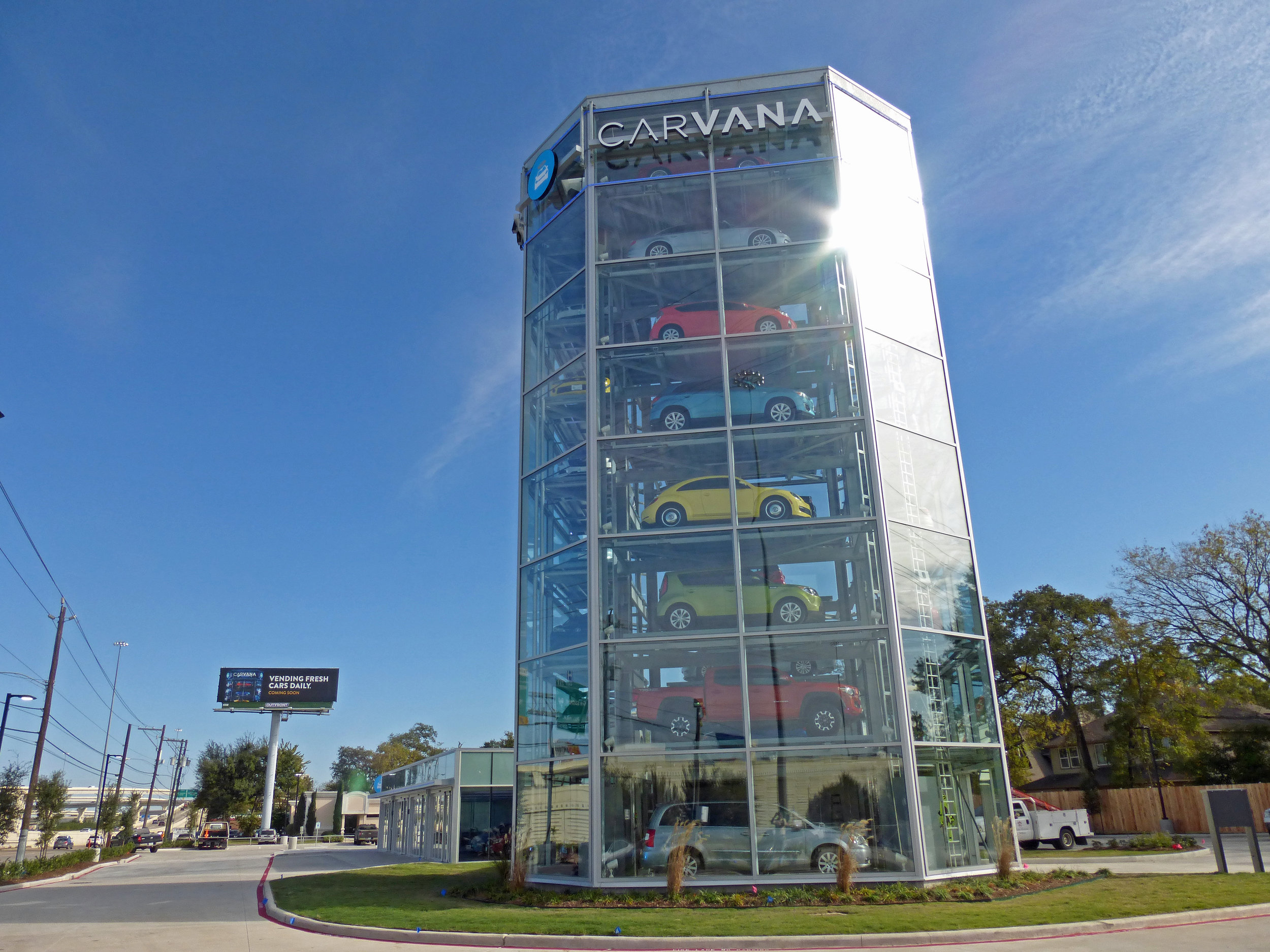 Cars stacked inside a glass Carvana vending tower in Houston