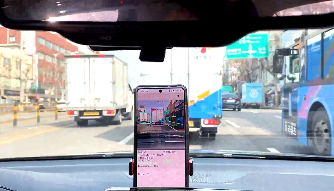 CARVI computer vision running on a phone inside a vehicle and outlining traffic ahead