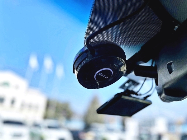 A CARVI camera mounted high on a vehicle windshield