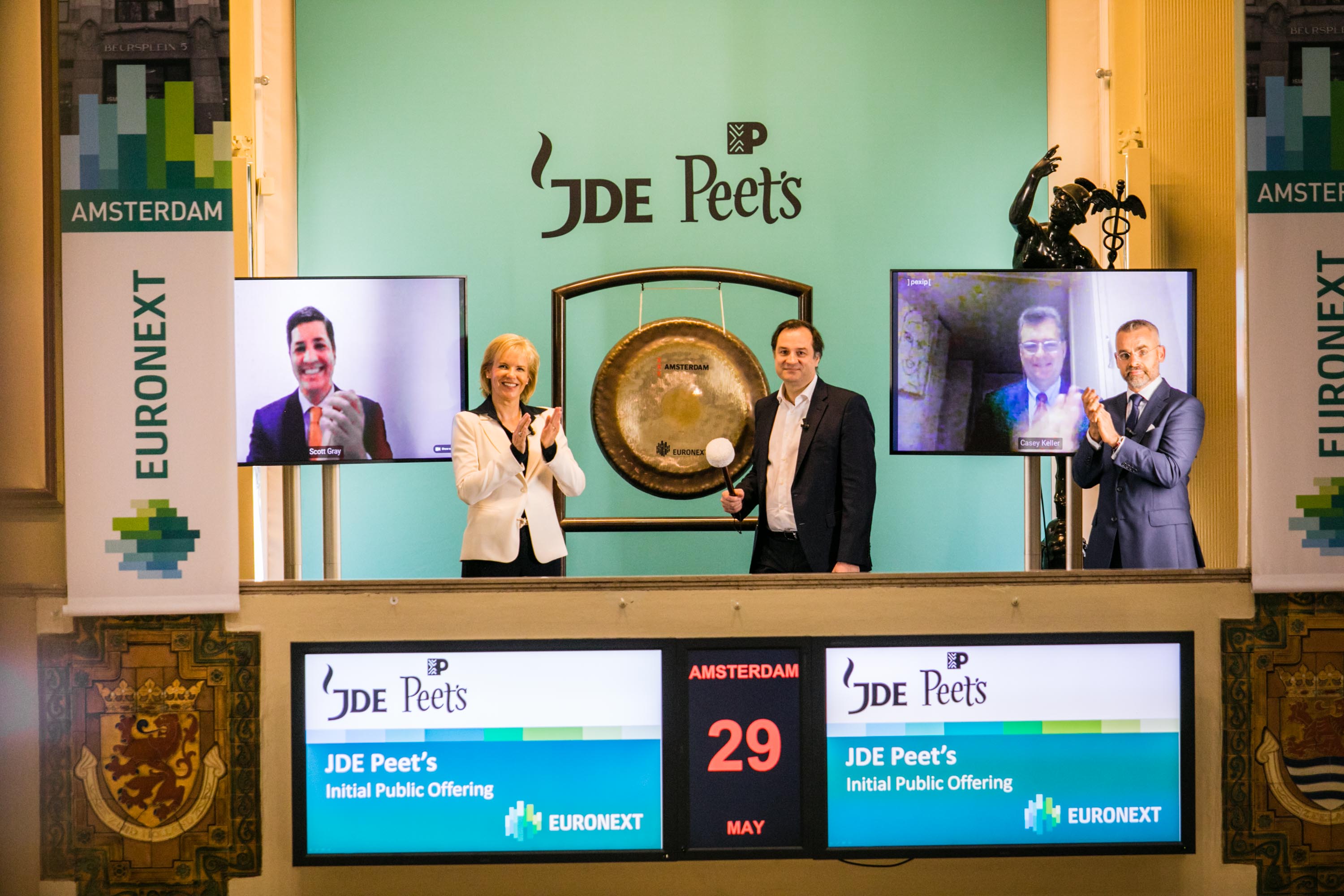 JDE Peet’s Amsterdam listing ceremony, with Casey Keller appearing on the right-hand video screen