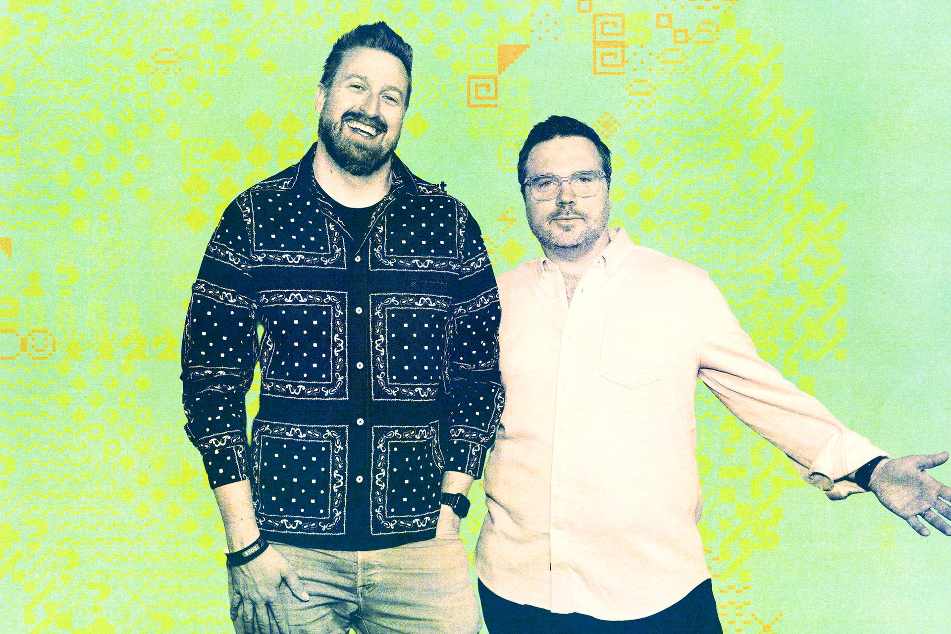 Casey Newton and Kevin Roose standing together against a bright patterned backdrop