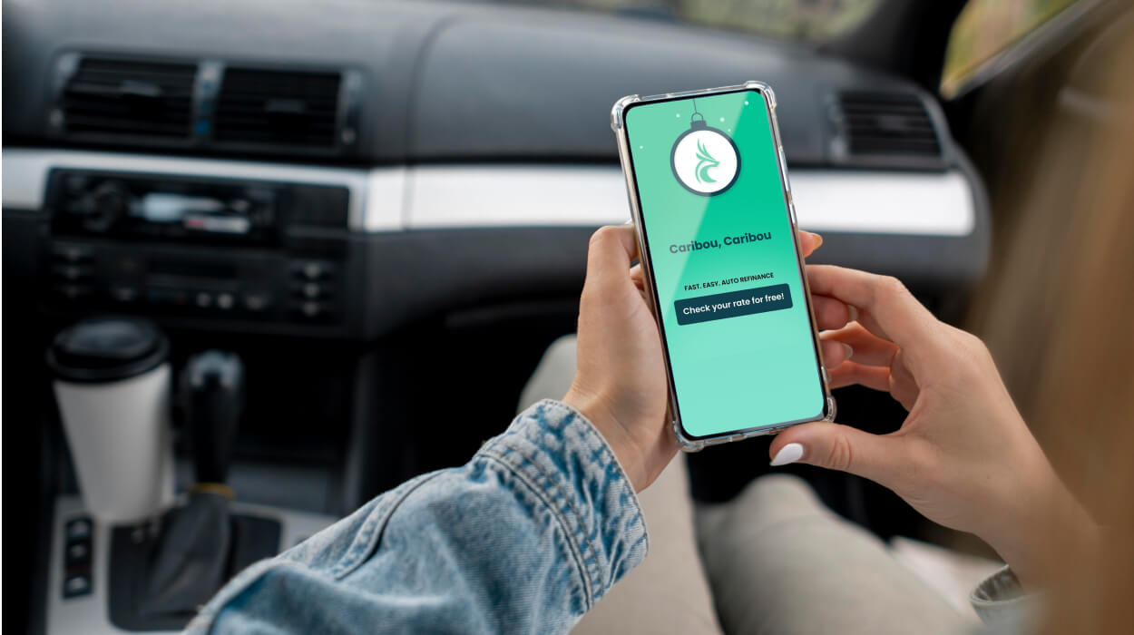Caribou auto refinancing brand shown on a phone