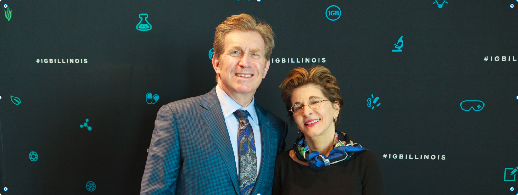 Don and Catherine Kleinmuntz together in front of an IGB Illinois event backdrop