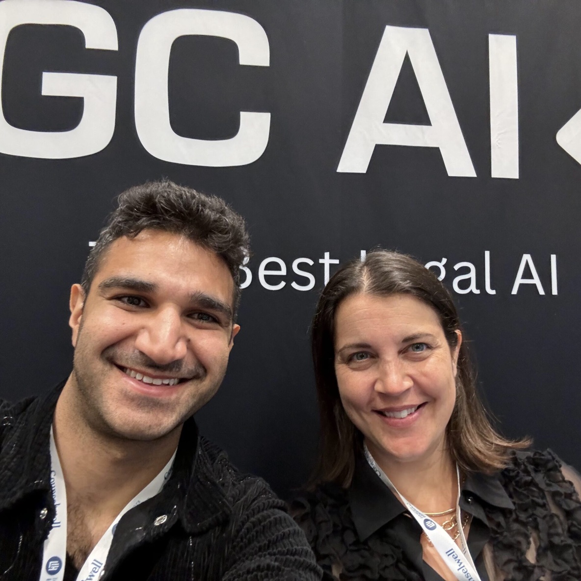 GC AI co-founders Bardia Pourvakil, left, and Cecilia Ziniti smiling at the company’s booth