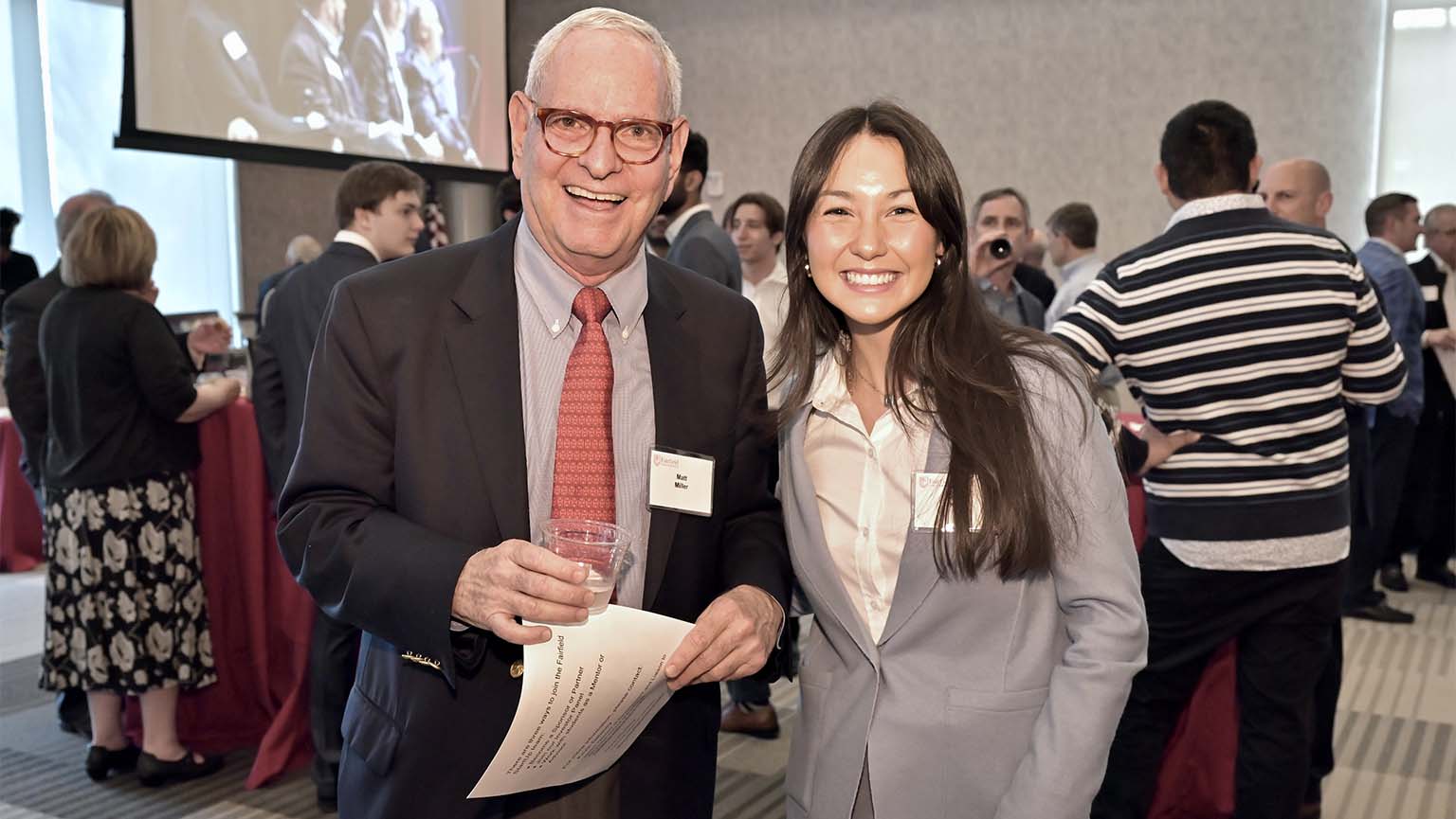 Celine King smiling beside her GreenIRR mentor Matthew Miller at Fairfield University's 2022 StartUp Showcase