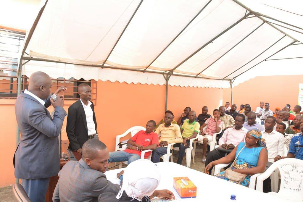 A speaker addresses seated attendees at Celpaid’s Adjamé authorized-agent meeting