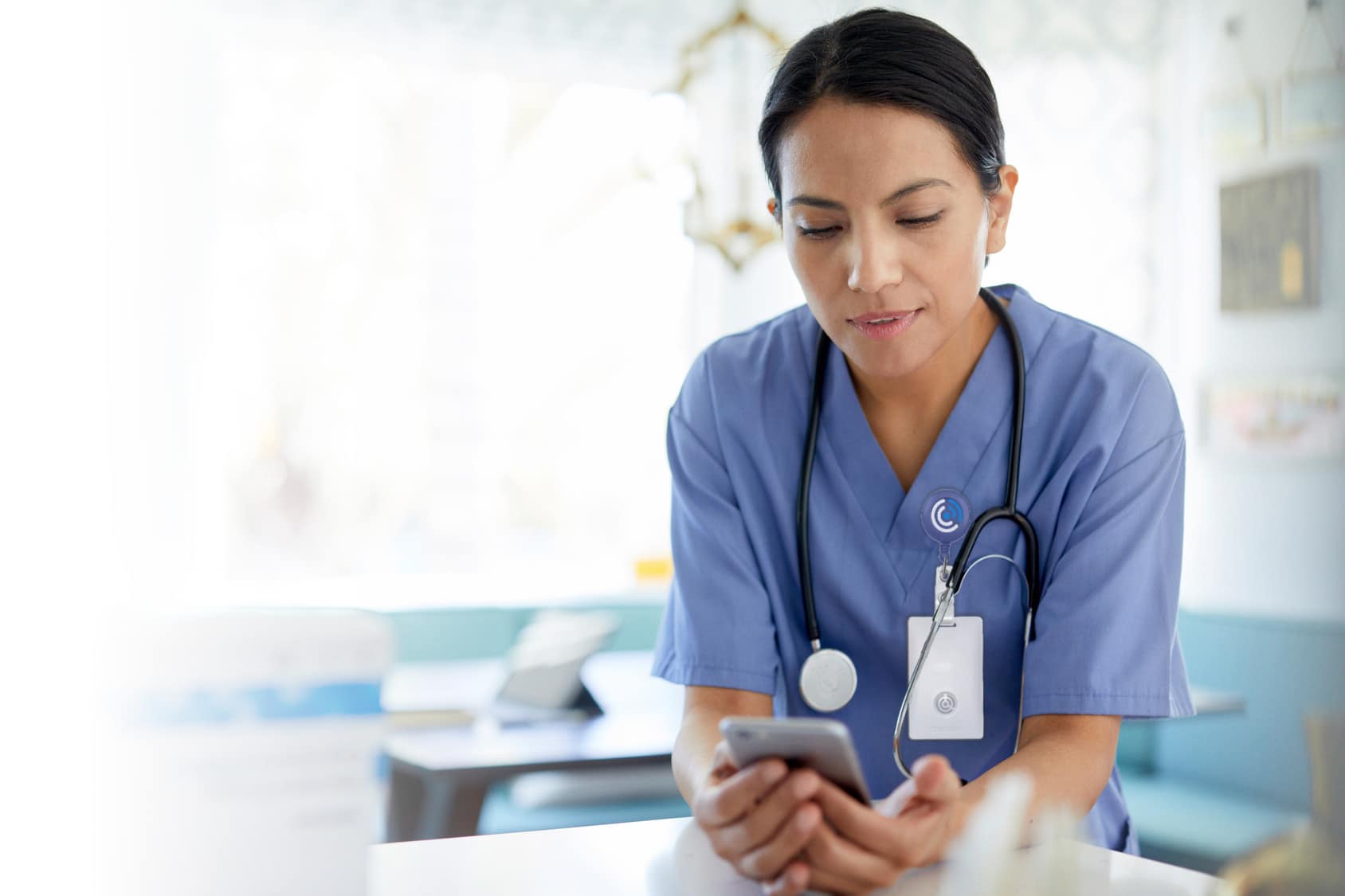 CENTEGIX promotional photograph of a healthcare worker wearing a CrisisAlert badge