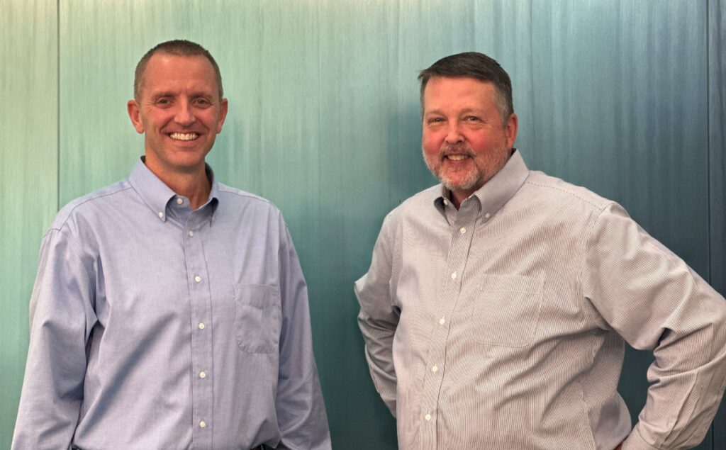 Brad Davis and Rick Silvers pose together for Centra’s leadership transition announcement