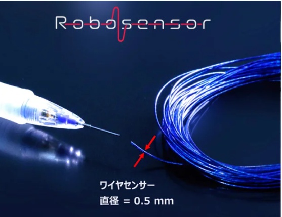 Robosensor wire sensor beside a pen tip, showing its small diameter