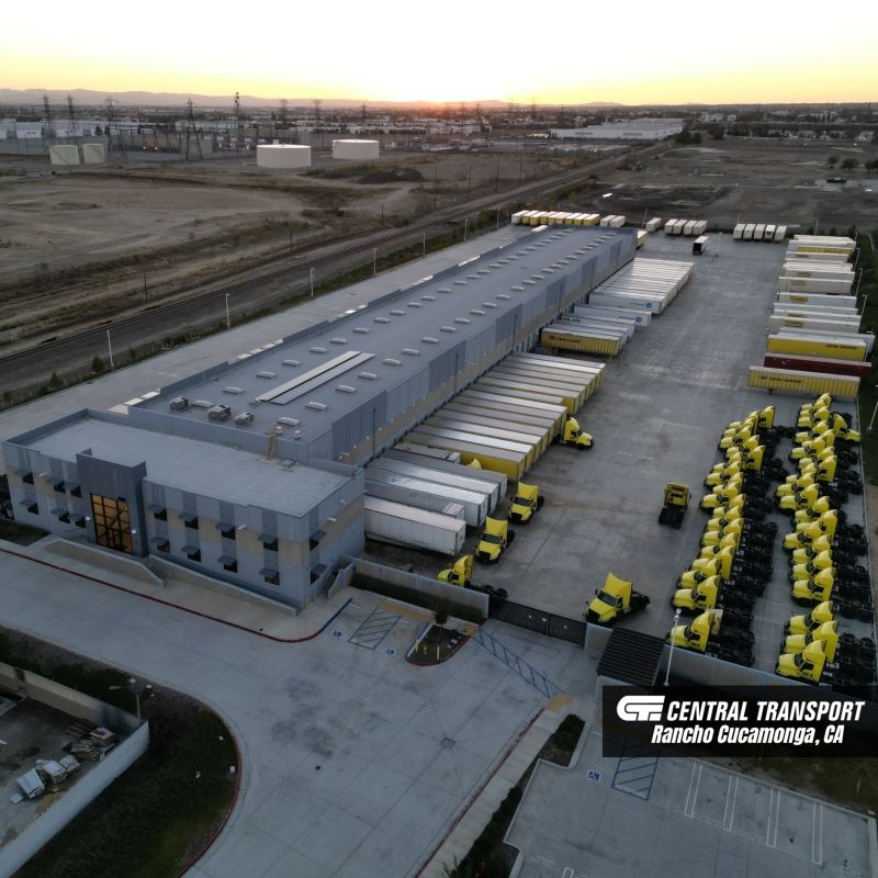 Aerial view of Central Transport’s Rancho Cucamonga terminal, with trailers at docks and yellow tractors parked in rows