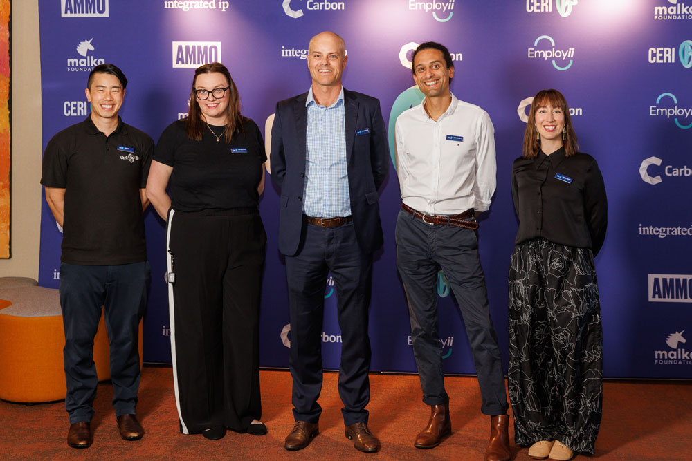 Five members of the CERI team standing together at an event