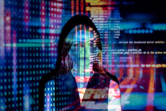 Illustrative portrait with colorful code projected over a person