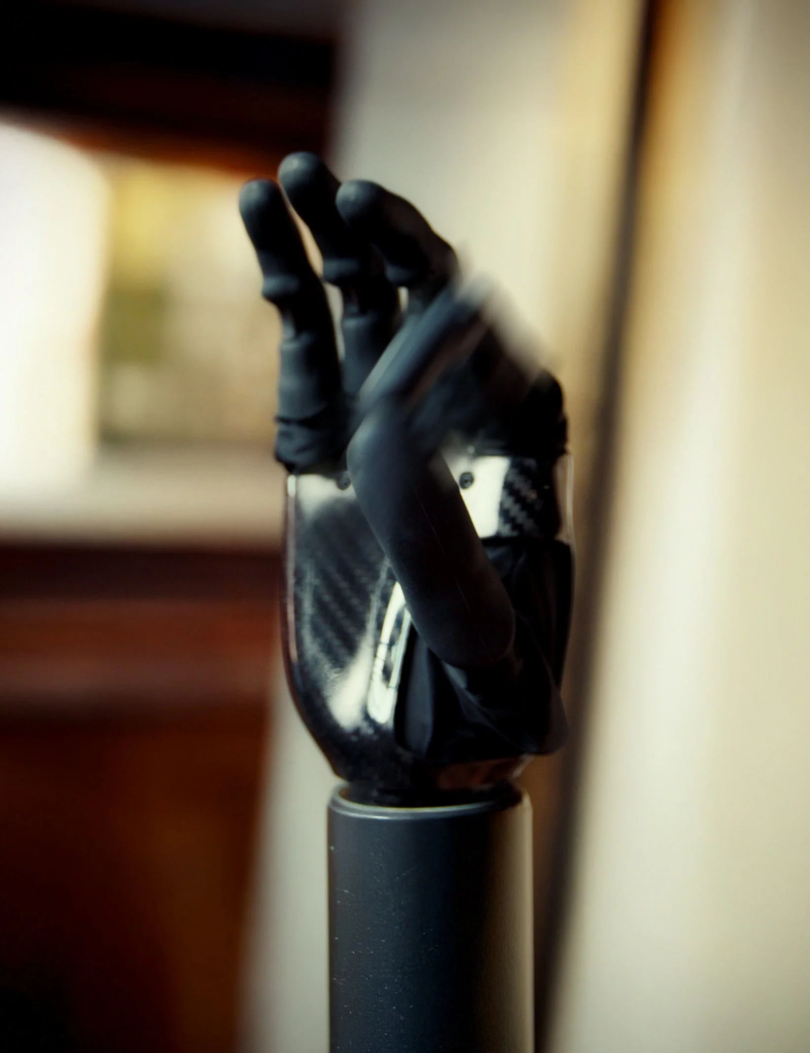 Close view of a black PSYONIC Ability Hand with articulated fingers