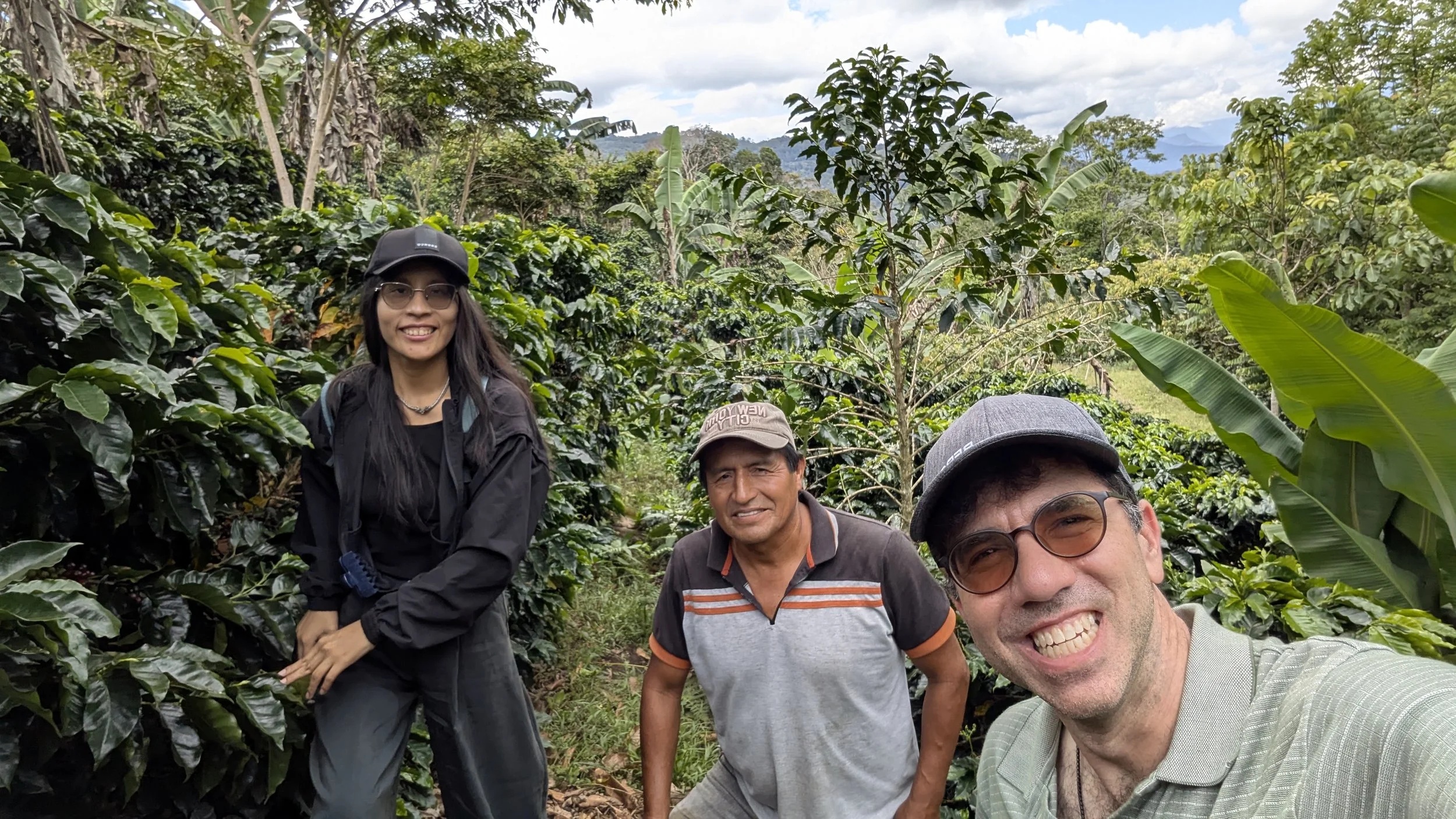 Ana Belen Jalixto Romero, Santa Ana founder Hector Perez, and Chad Sachs among coffee plants in Peru