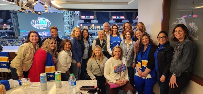 Chady AlAhmar with a group at the 2024 Big Ten basketball championship, in a photograph shared for International Women’s Day