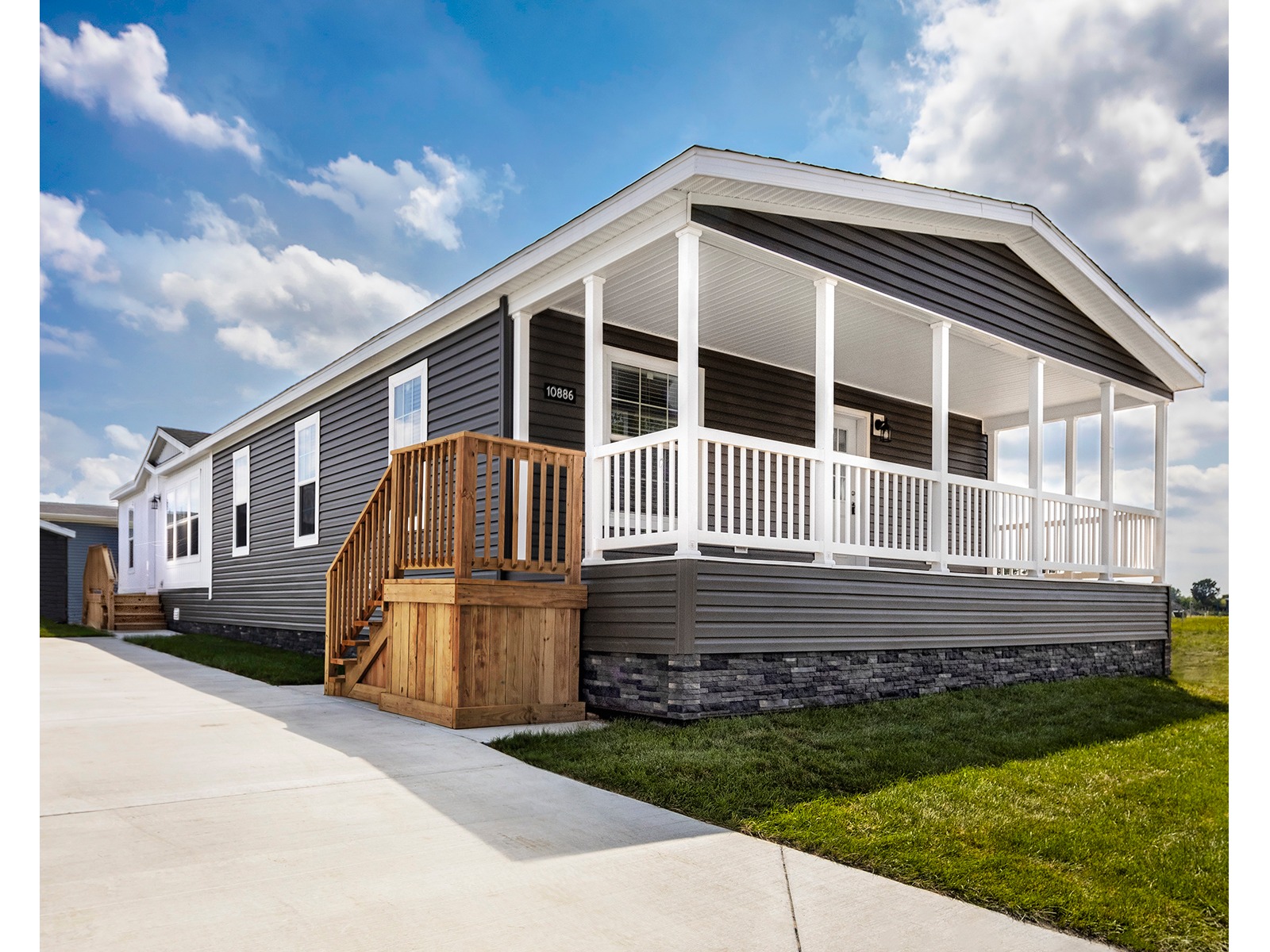 Champion manufactured home with a covered entrance and broad front windows