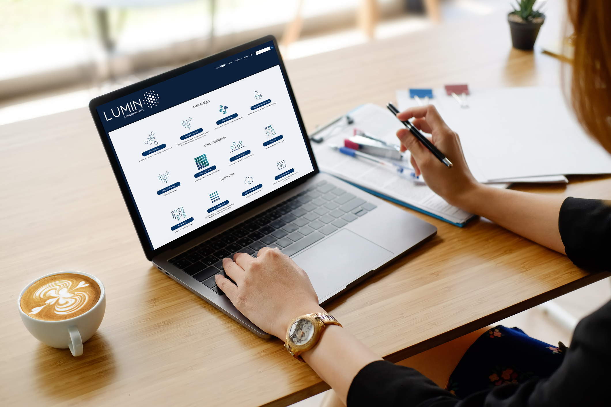 Champions Oncology promotional image showing Lumin bioinformatics software on a laptop