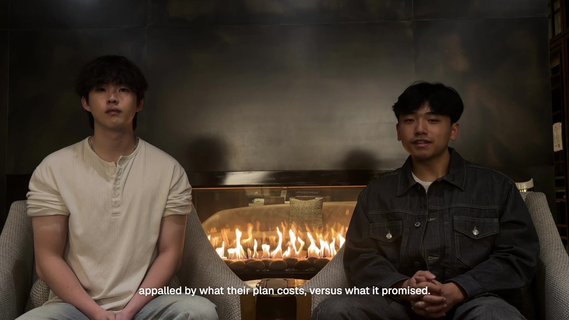 Insurf co-founders Bryan Chung and Chang Lu seated in front of a fireplace