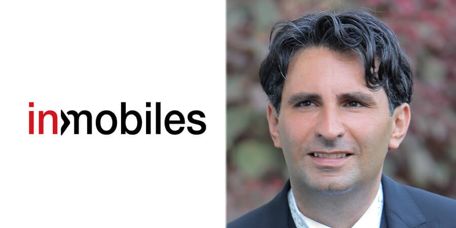 Charbel Litany pictured beside the InMobiles wordmark in a 2018 press photograph