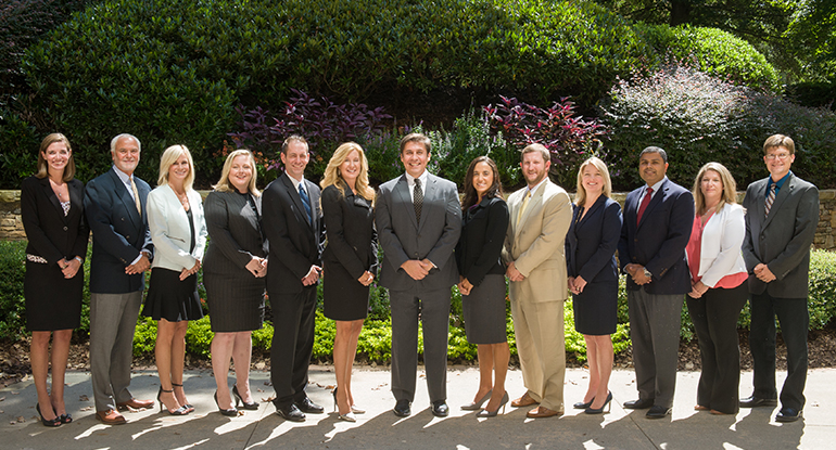 Senior partners of O'Kelley and Sorohan pose together outdoors
