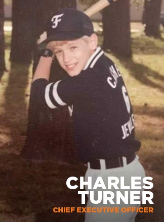 A childhood photograph of Charles Turner in a baseball uniform, published on KARE’s team page.
