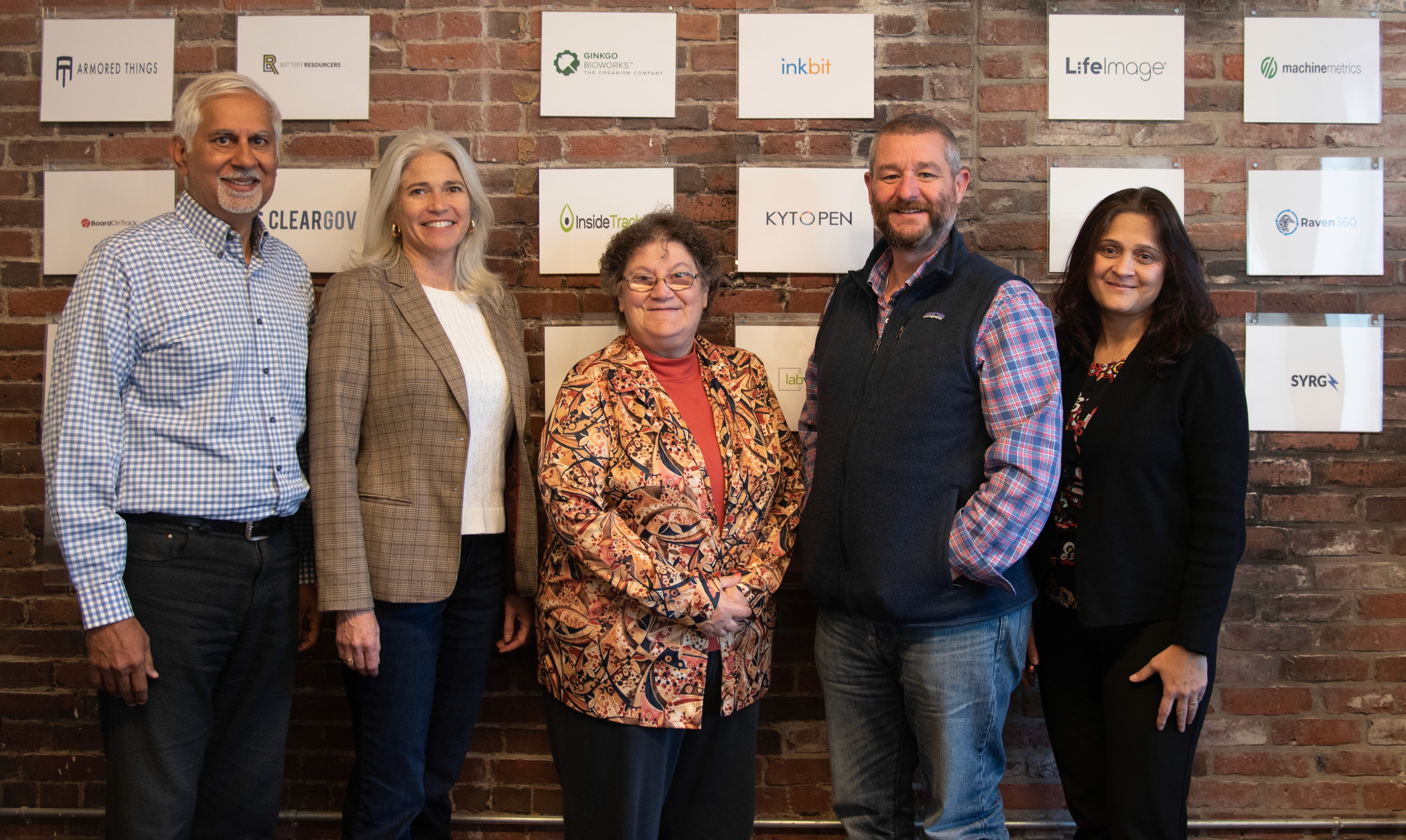 MassVentures colleagues standing together; Charlie Hipwood is second from the right