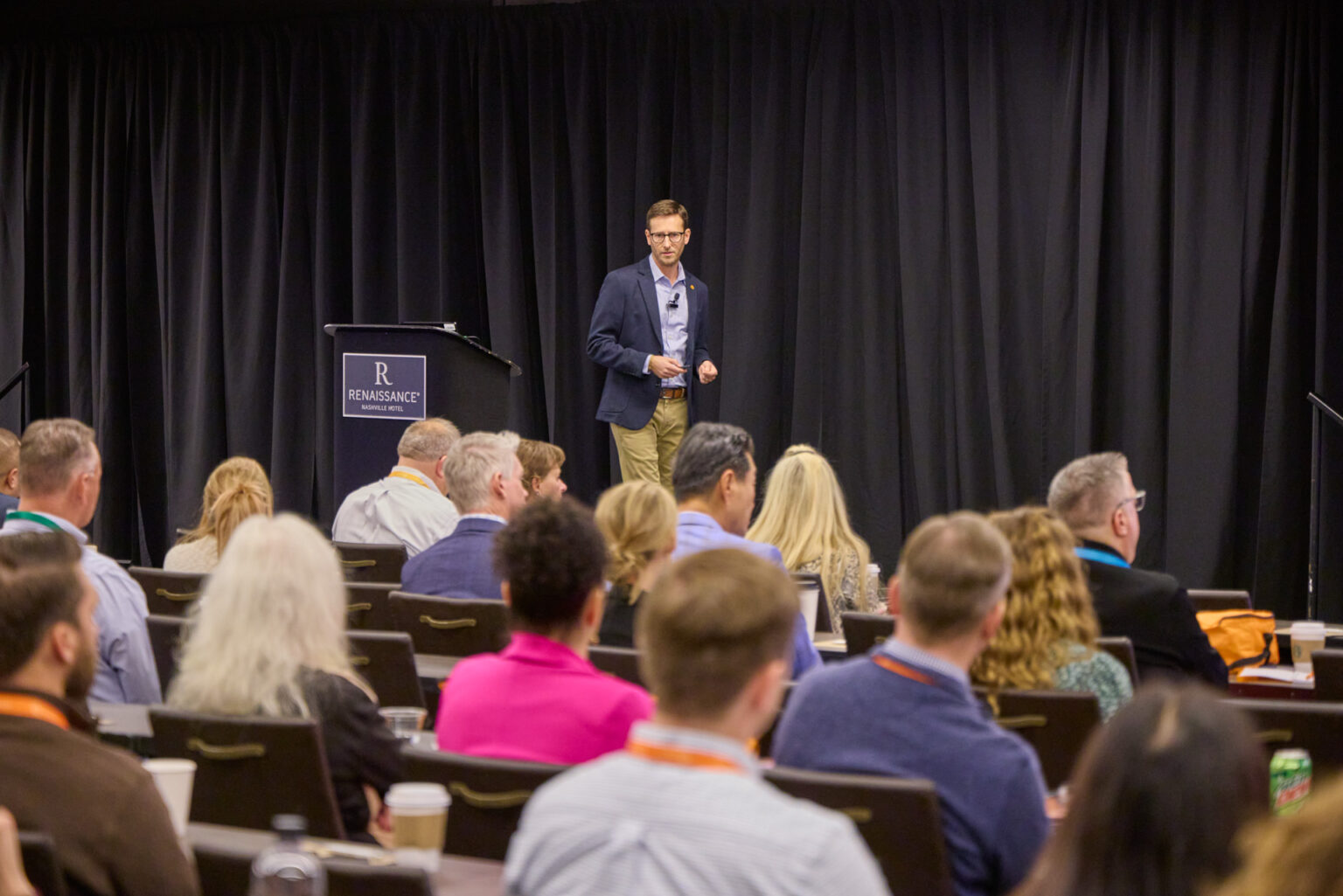 A speaker addresses seated attendees at Cheetah’s 2024 Hunt conference