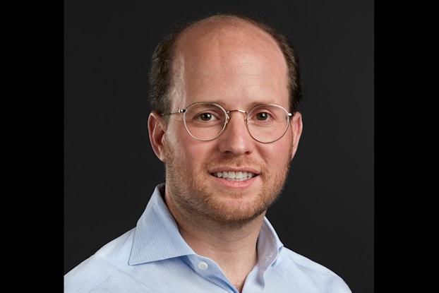 Chefman founder and CEO Ralph Newhouse wearing glasses and a light blue shirt