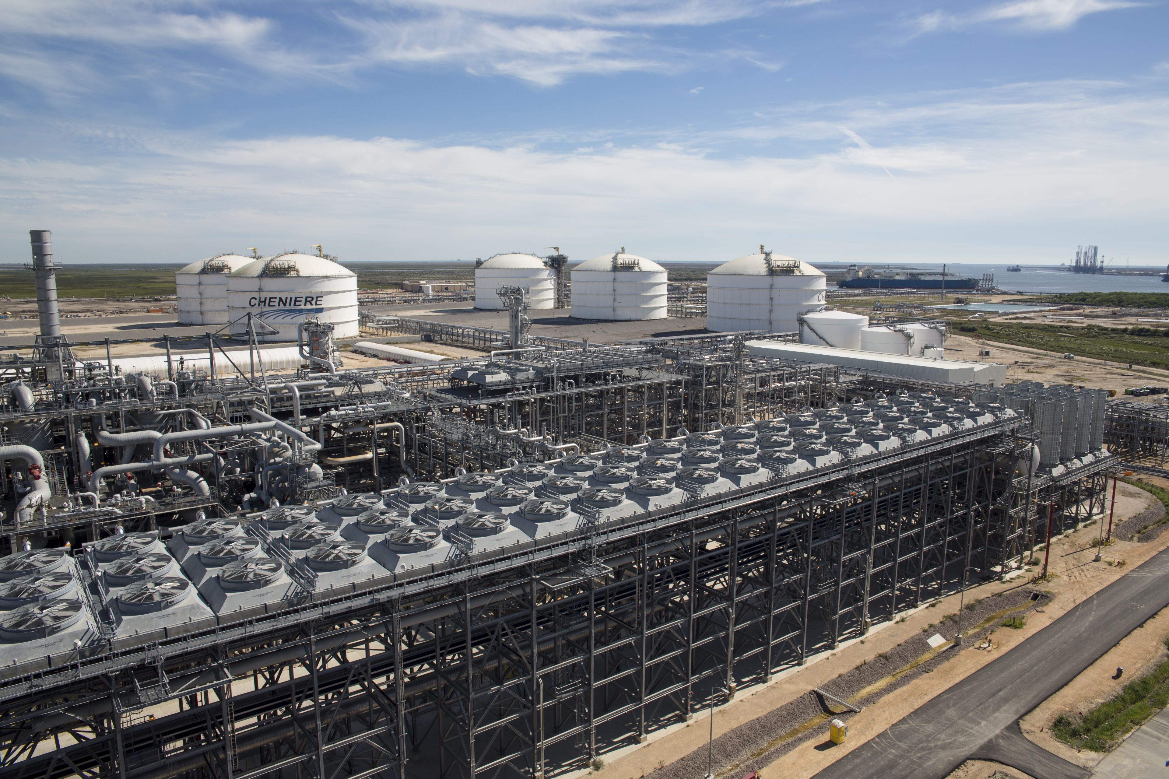 Processing equipment and large white LNG storage tanks at Cheniere’s Sabine Pass facility
