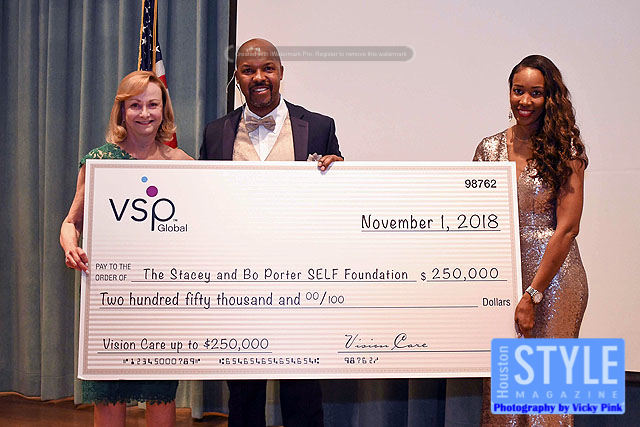 Cherrill Farnsworth, left, at a check presentation with Bo and Stacey Porter during the SELF Foundation Legacy Gala
