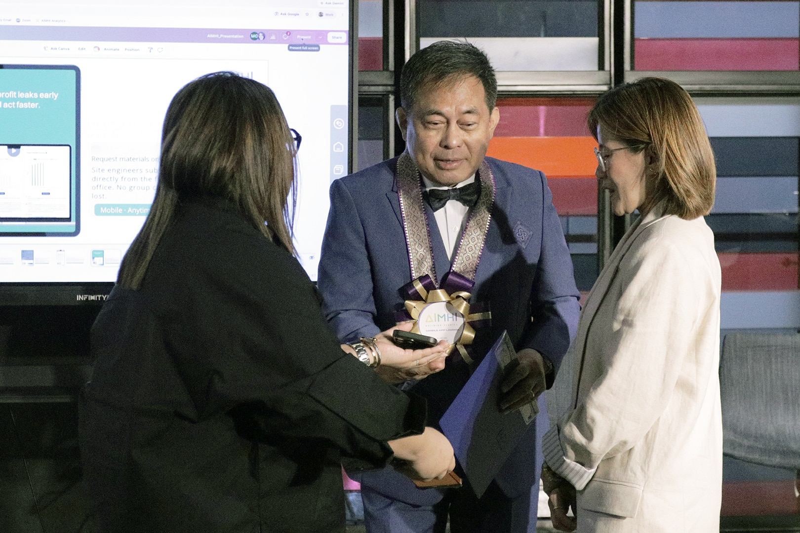 Cherryanne Lee Angoy with participants during the AIMHI Mobile launch event at Benilde
