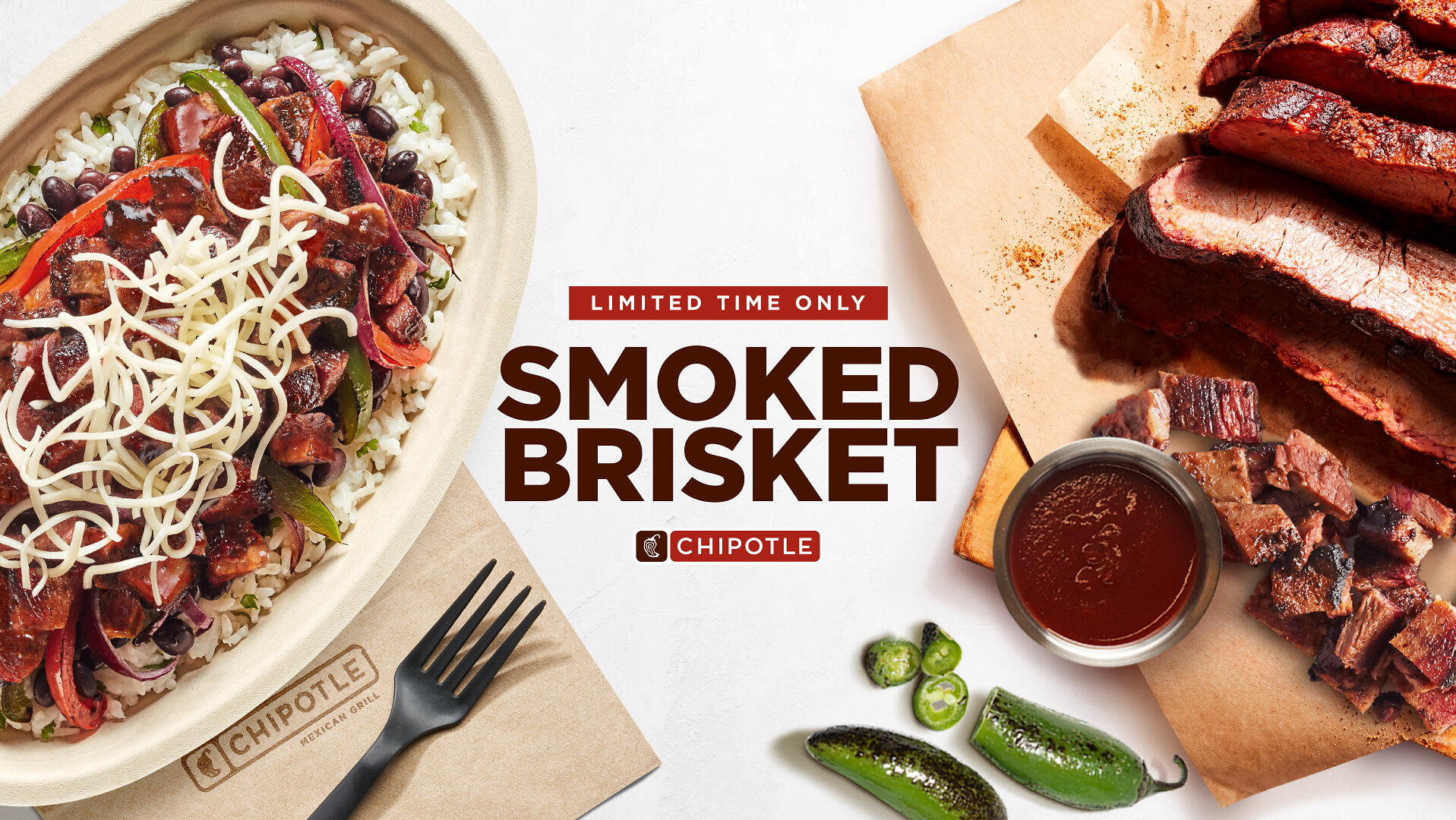 A Chipotle bowl topped with smoked brisket, rice, beans, salsa and cheese