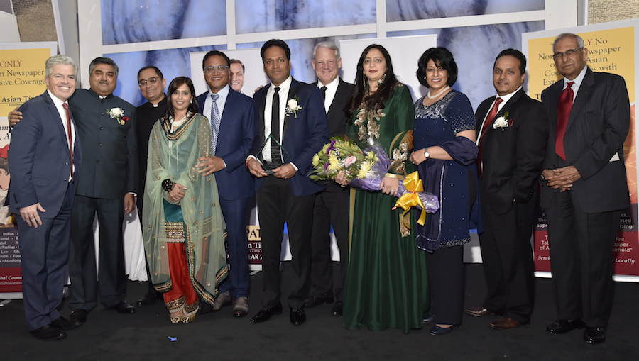 Chirag and Chintu Patel with their wives and guests at a recognition reception in Syosset, New York