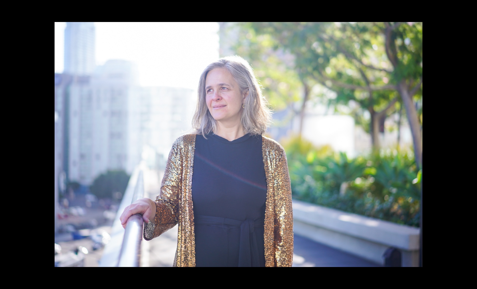Chloe Capital co-founder Elisa Miller-Out standing by an outdoor railing