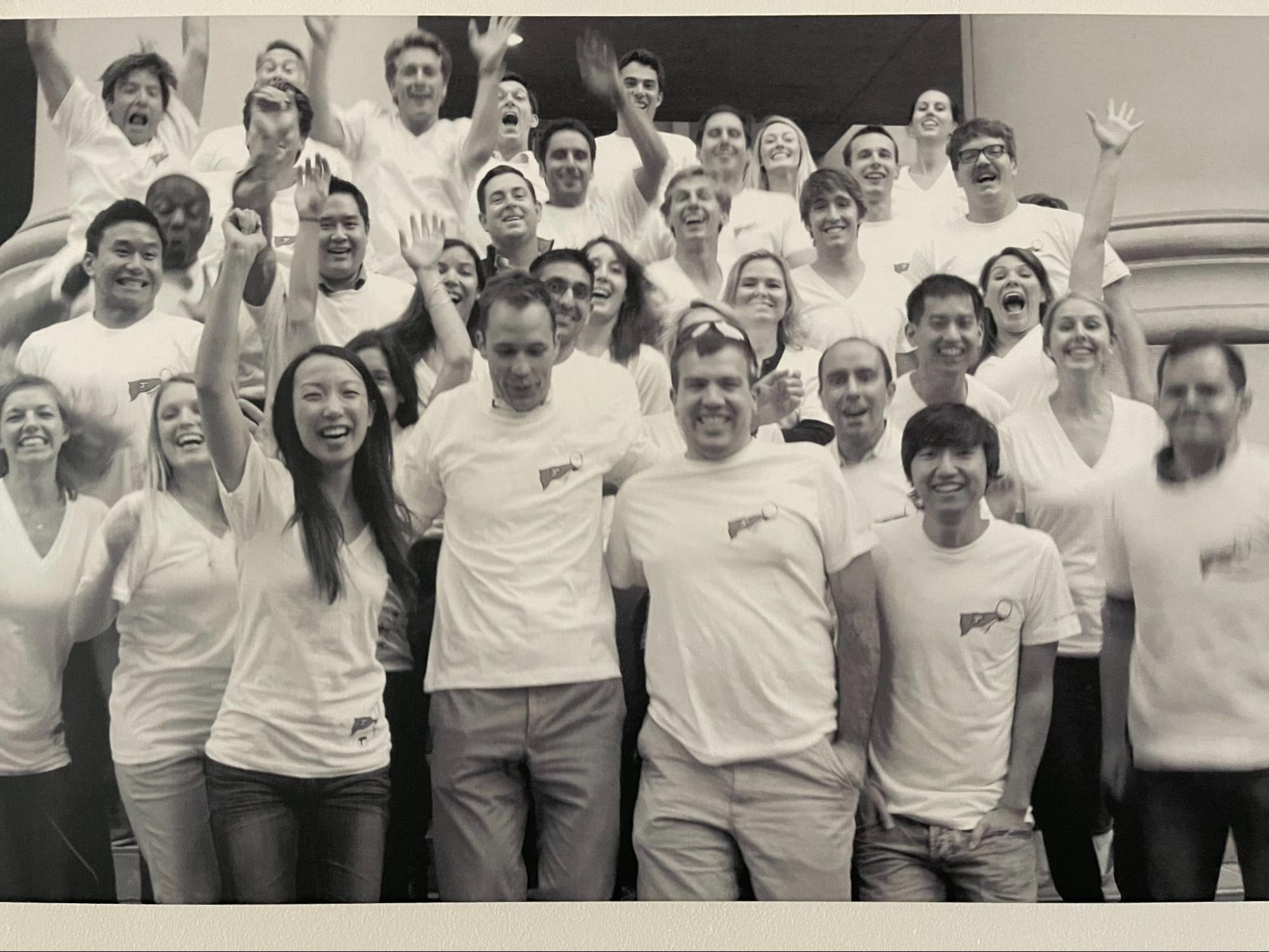 Chris Andrew, Robert MacCloy and colleagues posing in a lively black-and-white Hearsay Systems team photograph