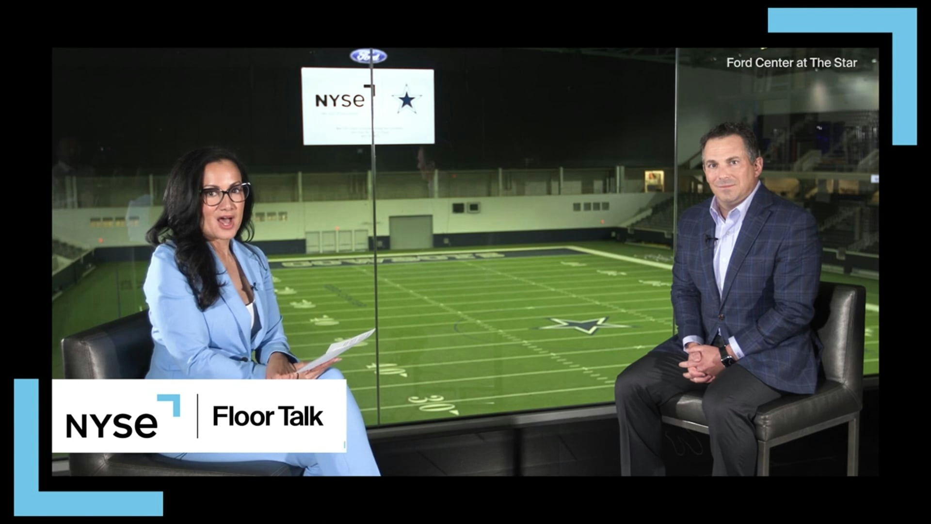 Judy Shaw interviews Chris Bradshaw, seated at right, for NYSE Floor Talk.
